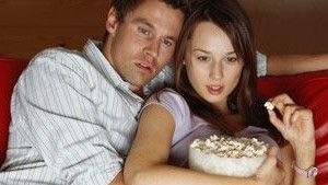 Couple Cuddling with Popcorn