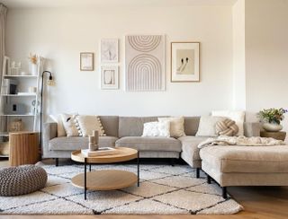 Cream-colored living room with a black and white rug