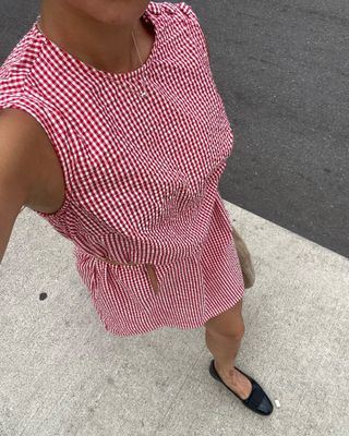 Woman in red and white summer dress.