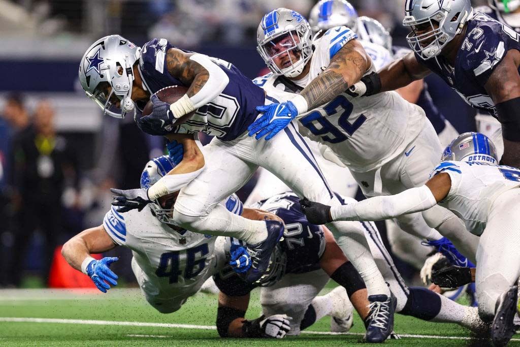 Tony Pollard #20 of the Dallas Cowboys runs the ball during an NFL football game against the Detroit Lions at AT&amp;T Stadium on December 30, 2023