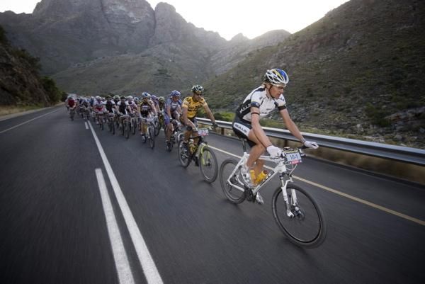 A Bulls rider takes a pull on a road section.