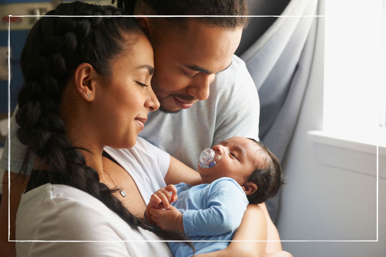 Parents holding their newborn baby