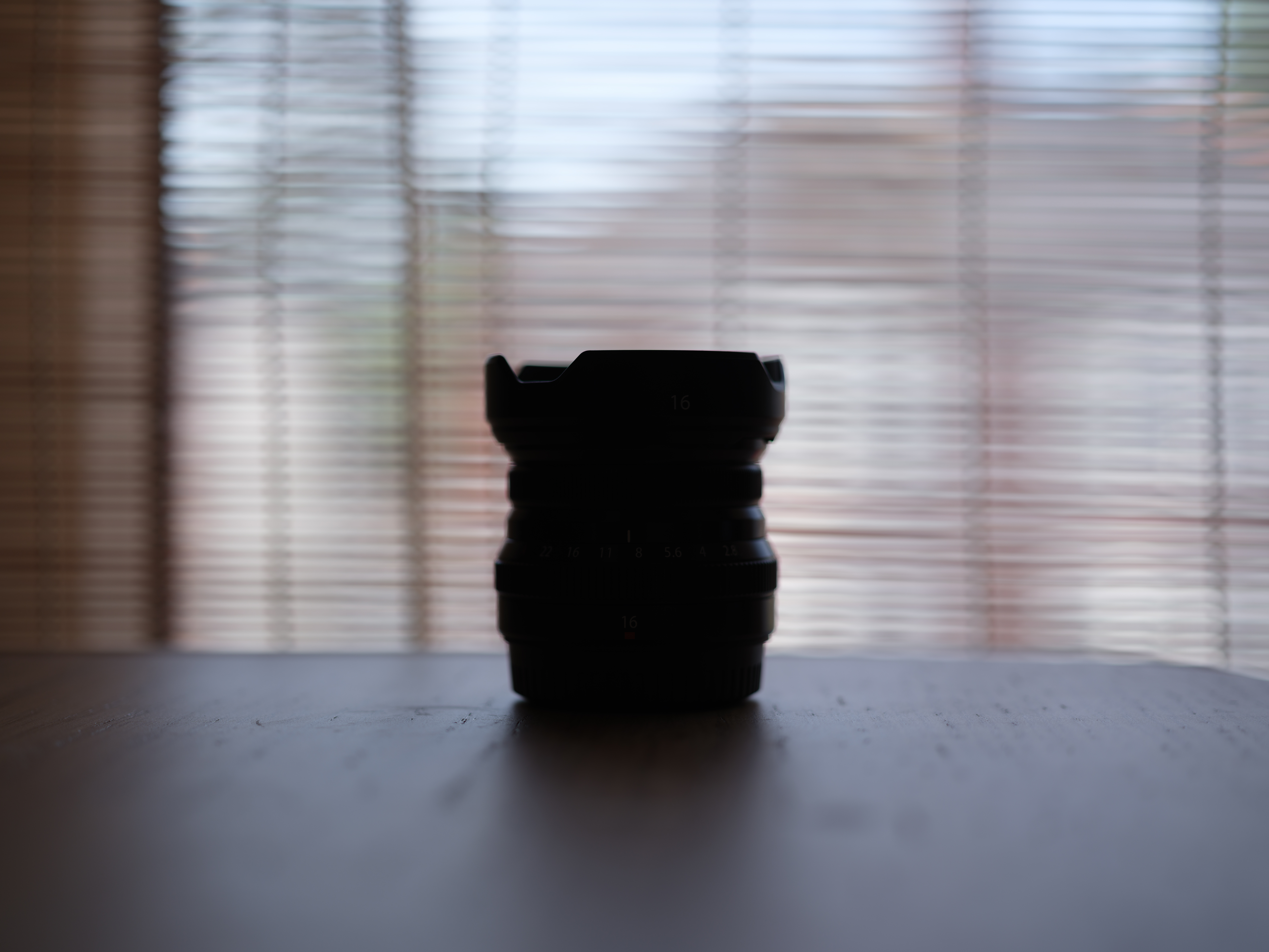 A backlit photo of a lens, taken on the Fujifilm GFX100 II.