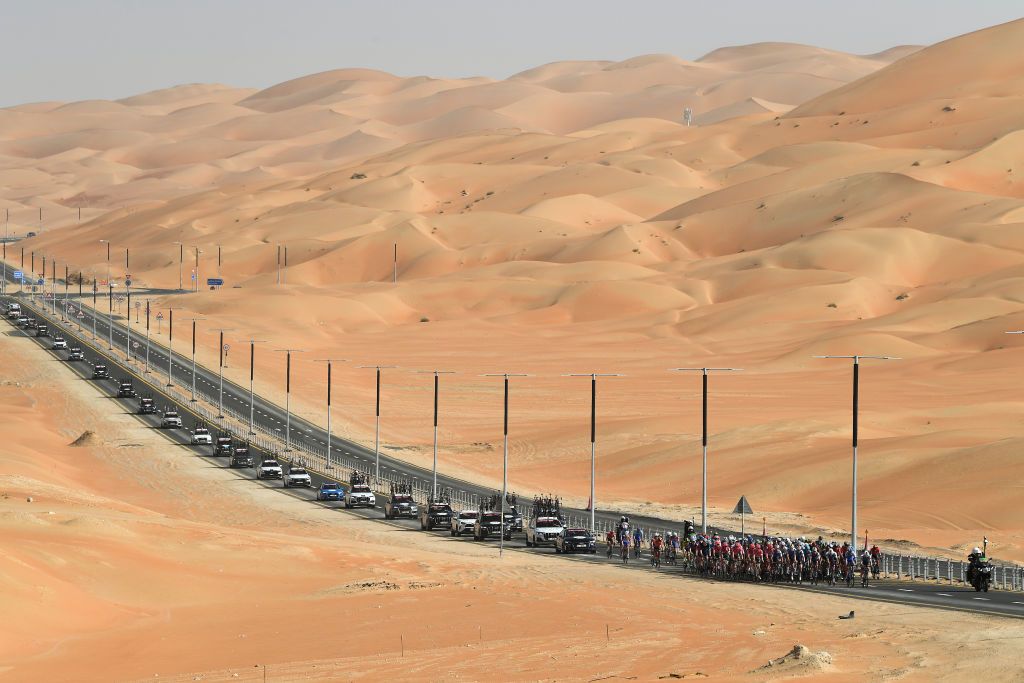 MADINAT ZAYED UNITED ARAB EMIRATES FEBRUARY 20 A general view of the Peloton passing through the desert during the 4th UAE Tour 2022 Stage 1 a 184km stage from Madinat Zayed to Madinat Zayed UAETour WorldTour on February 20 2022 in Madinat Zayed United Arab Emirates Photo by Tim de WaeleGetty Images