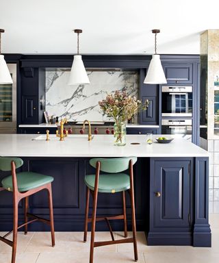 navy kitchen with white countertops