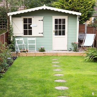 garden area with summer house and grassland