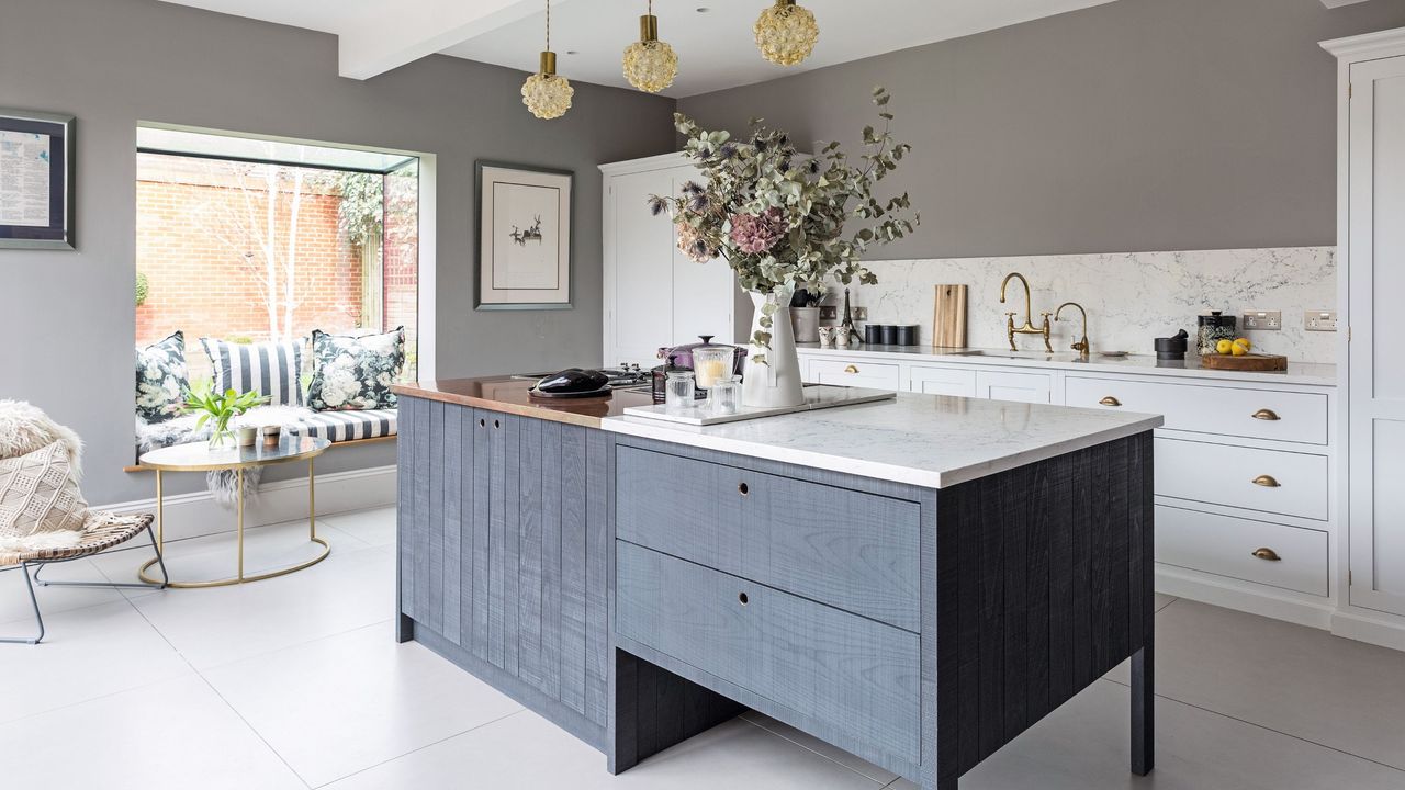 Kitchen renovation project with blue cabinets and island 