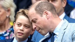 Prince George of Wales with his father, Prince William, Prince of Wales, in the Royal Box during Gentlemen's Singles Final match