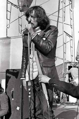 Rolling Stones tour manager Sam Cutler tries to calm the crowd at the ill-fated Altamont concert in California on December 6, 1969