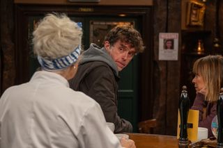 Marlon Dingle in the Woolpack talking to Rhona and Mary