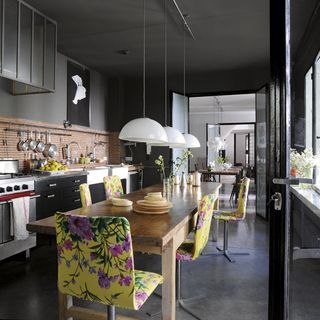 kitchen with yellow chair and hanging lights