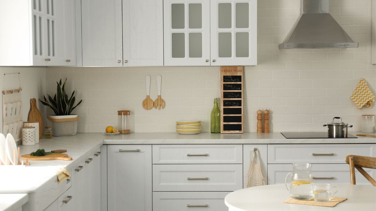 A luxury kitchen in white with white cupboards