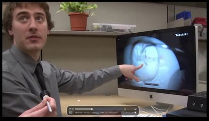 Researcher touching a computer screen