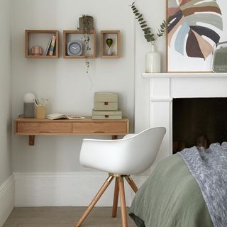 room with white wall and chair
