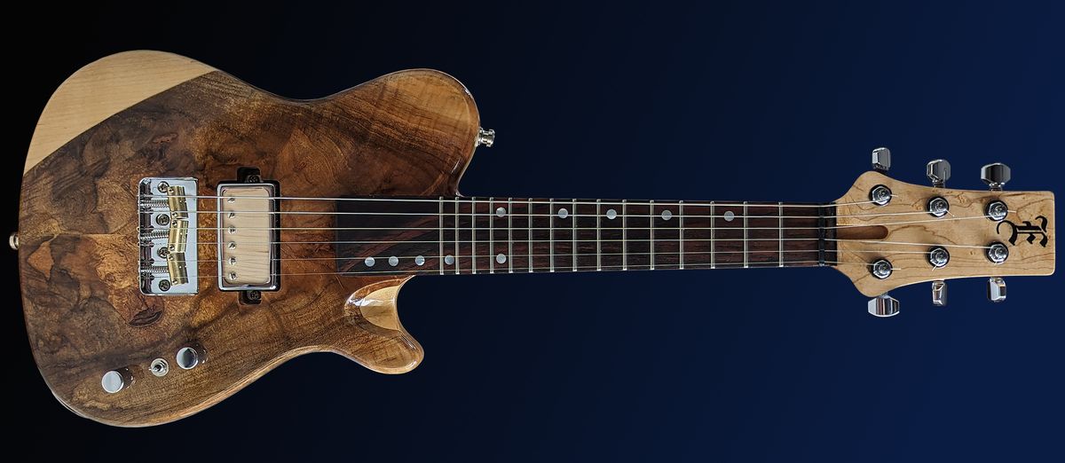 A photo of the Ellis Guitars Soprano TX, a short-scale guitar tuned an octave above a standard guitar, allowing you to create mandolin-like tones from a familiar six-string instrument