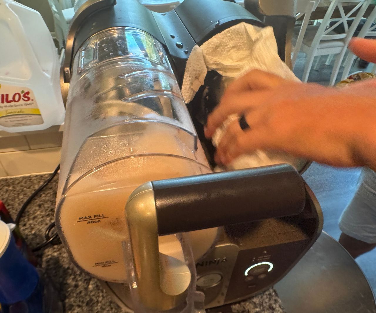 cleaning down one of the auger on one side of the Ninja Slushi Twist