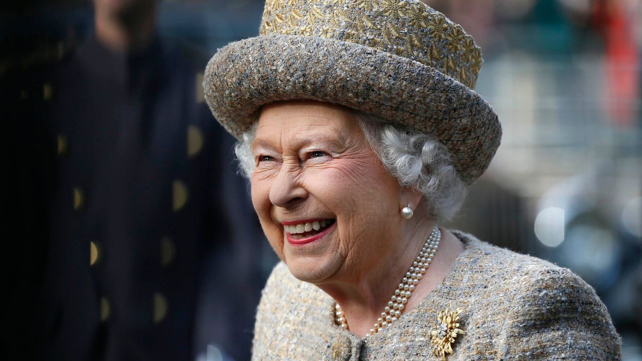 Queen Elizabeth II smiles as she arrives before the Opening of the Flanders' Fields Memorial Garden at Wellington Barracks, 2014