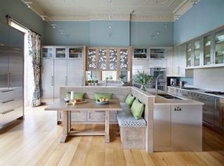 Large L-shaped kitchen with island and blue walls
