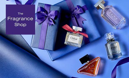 The Fragrance shop logo top left with 4 perfume bottles on top of blue presents