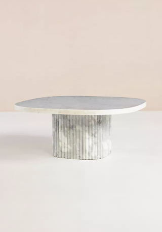 Marble pedestal coffee table.