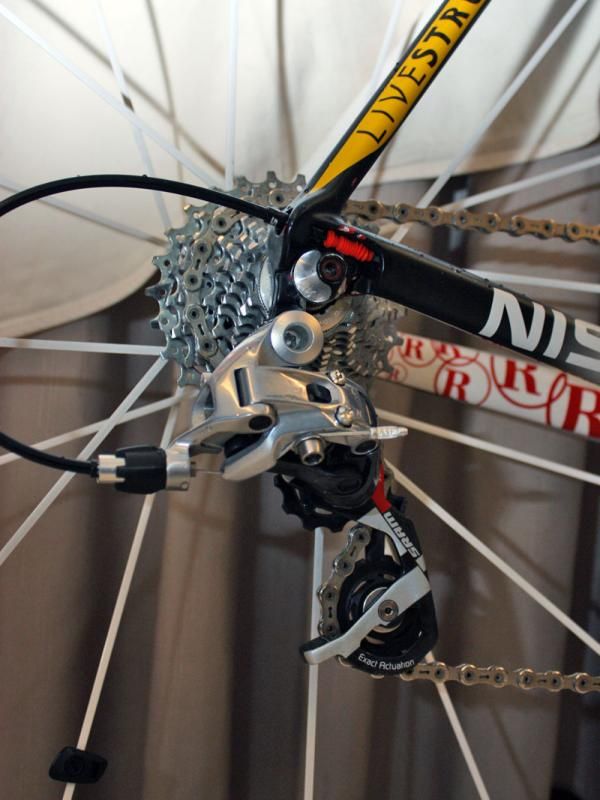 A SRAM Red rear derailleur is bolted to a replaceable hanger.