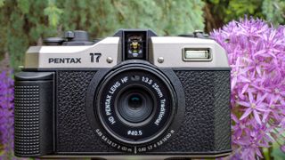 The Pentax 17 half-frame film camera in black and silver.