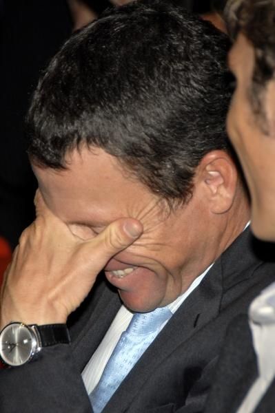 Lance Armstrong laughs at Andy Schleck's joke.