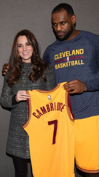 Kate Middleton being presented a basketball jersey by LeBron James