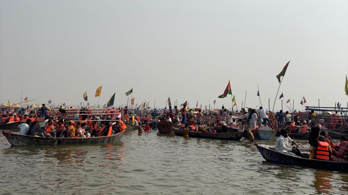Boats full of pilgrims on the River Ganges at the Kumbh Mela