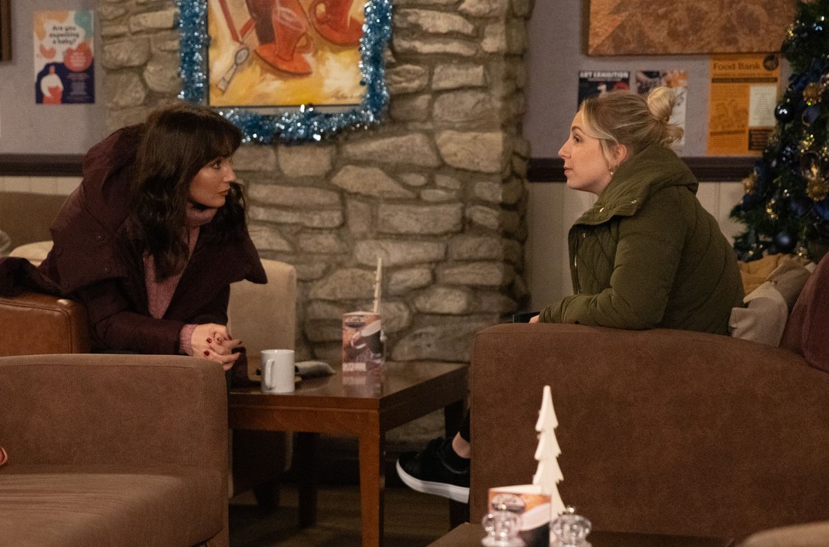 Belle and Leyla chat in the cafe in Emmerdale. 