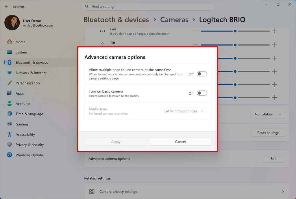 Windows settings screen with Advanced camera options dialog, showing toggle switches for camera use settings.