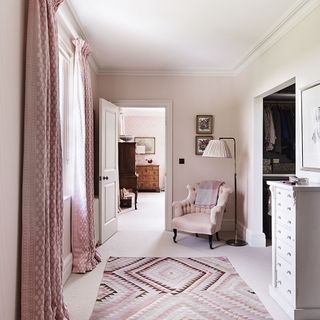 corridor with pink curtains and pink geometric rug