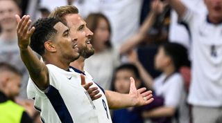 Jude Bellingham and Harry Kane celebrate the midfielder's late equaliser for England against Slovakia at Euro 2024.
