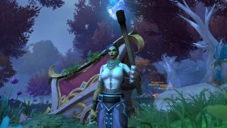 WoW triple-locked safebox: A close-up of a player stood next to a broken cart in the woods, holding a torch.