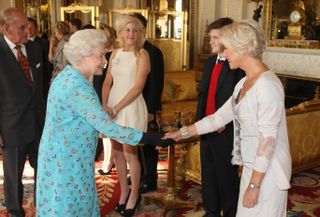 Helen Mirren meeting The Queen at Buckingham Palace in 2011