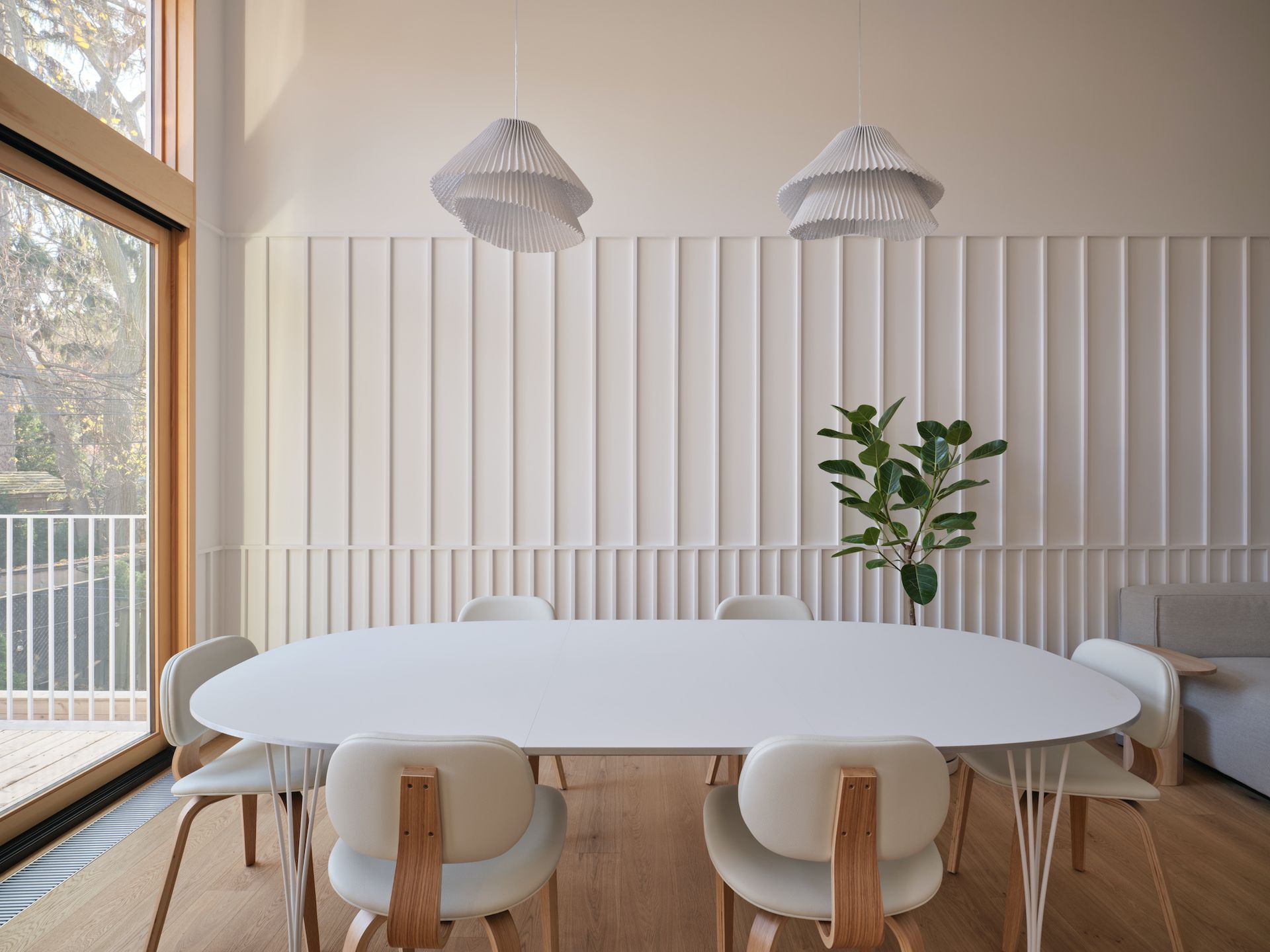 A minimalist-inspired white wainscoting stretches up and down the walls