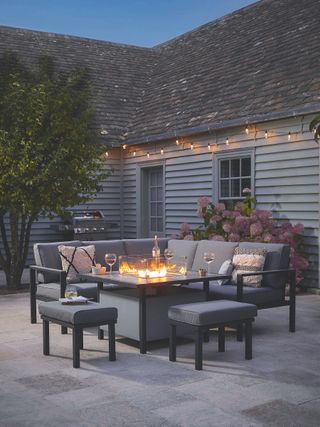 fire pit with chairs surrounding outdoor entertaining area