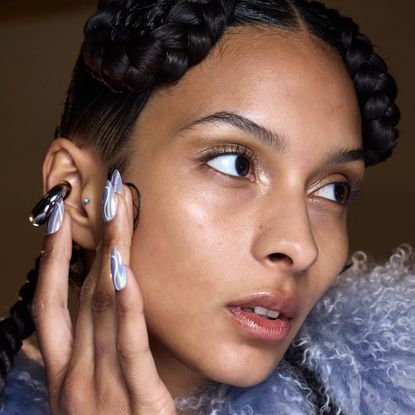 Model wearing press-on nails