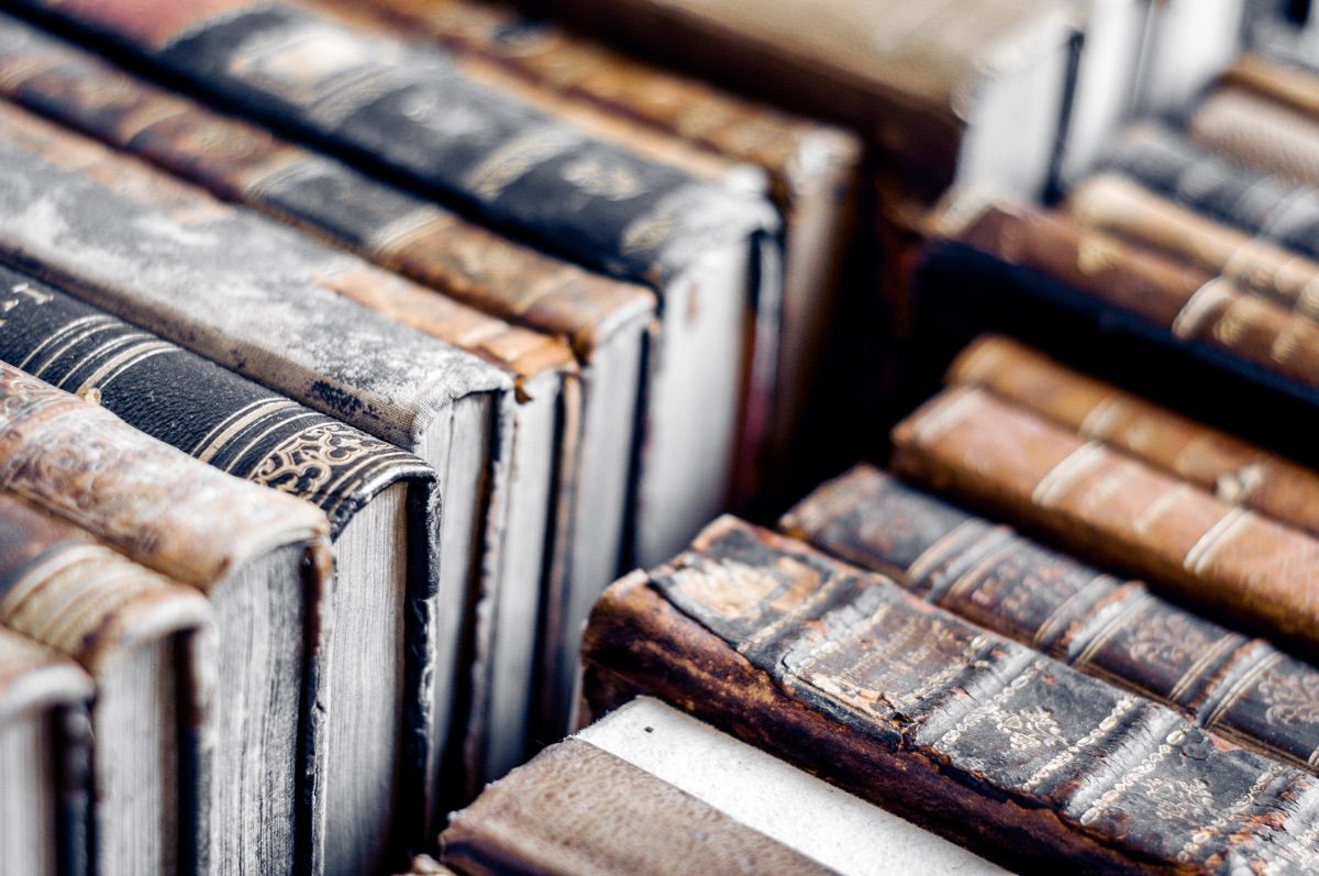 old books on a library shelf.