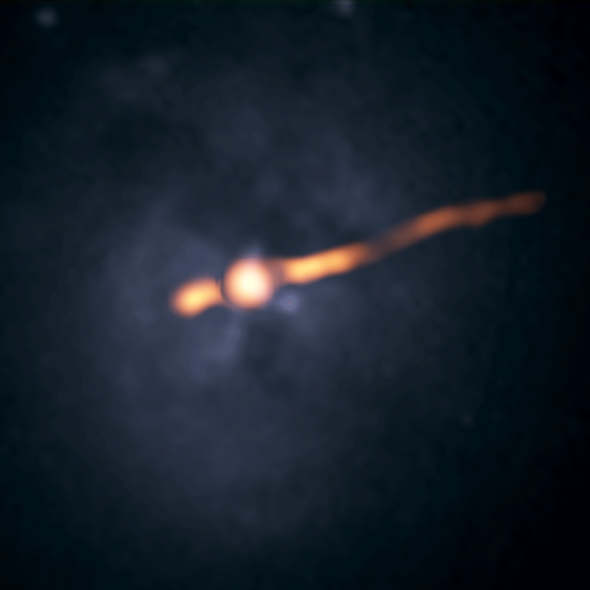 This GIF shows VLA radio images (orange) of the central region of the galaxy Cygnus A from 1989 and 2015, overlaid on a Hubble Space Telescope photo.