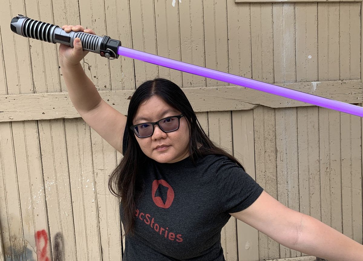 Christine poses with lightsaber
