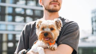 Man holding dog