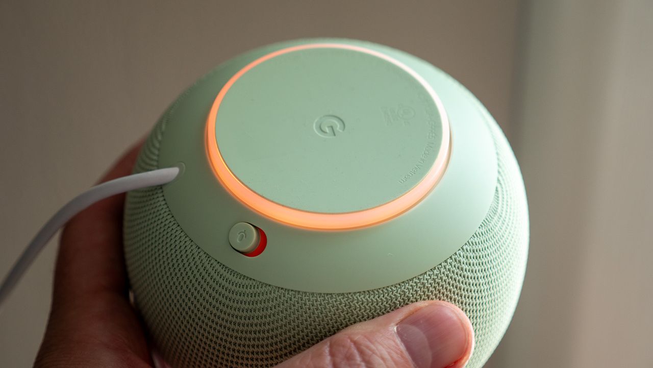 The mute button and amber LEDs on the underside of the Google Home Speaker