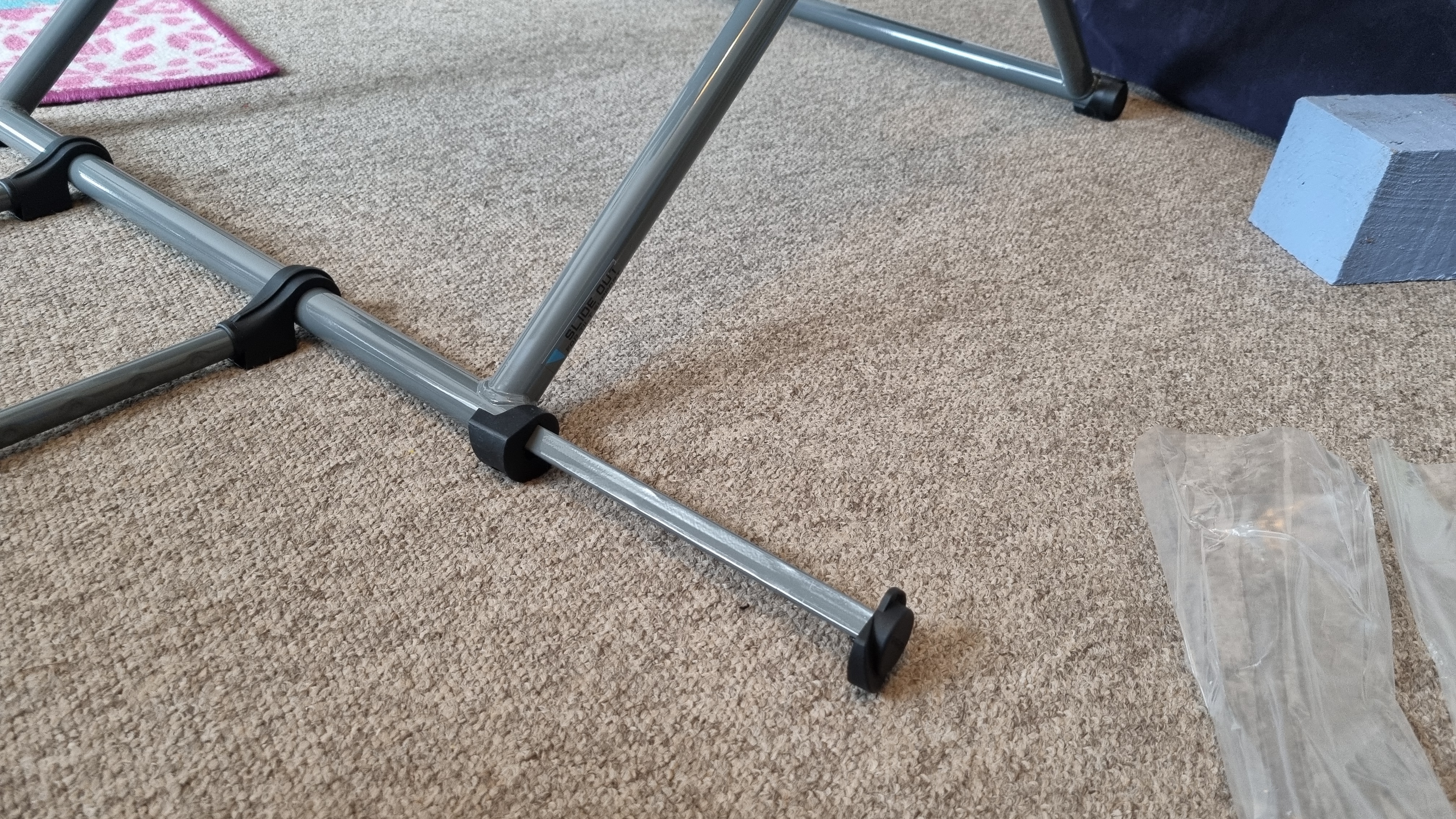 The extendable leg on the Logitech Playseat Challenge X that prevents it from tipping over