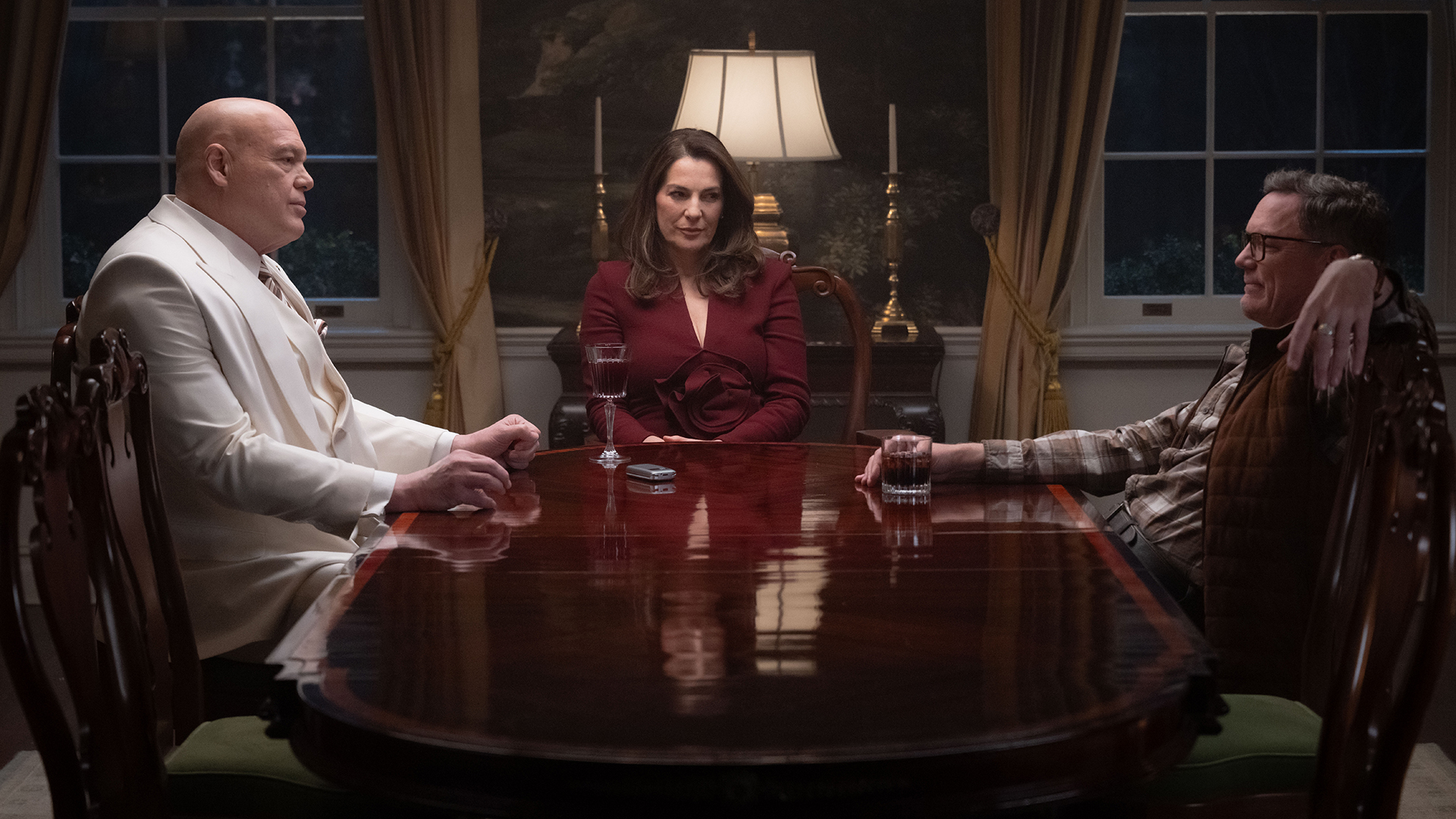 Mayor Wilson Fisk and Vanessa Fisk sitting at a table with Mr. Charles in Daredevil: Born Again season 2