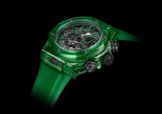 Bright green watch on a black background