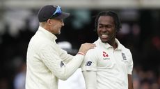 England captain Joe Root celebrates an Australia wicket with bowler Jofra Archer 