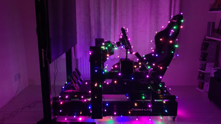 Nanoleaf smart holiday string lights wrapped around a racing chair