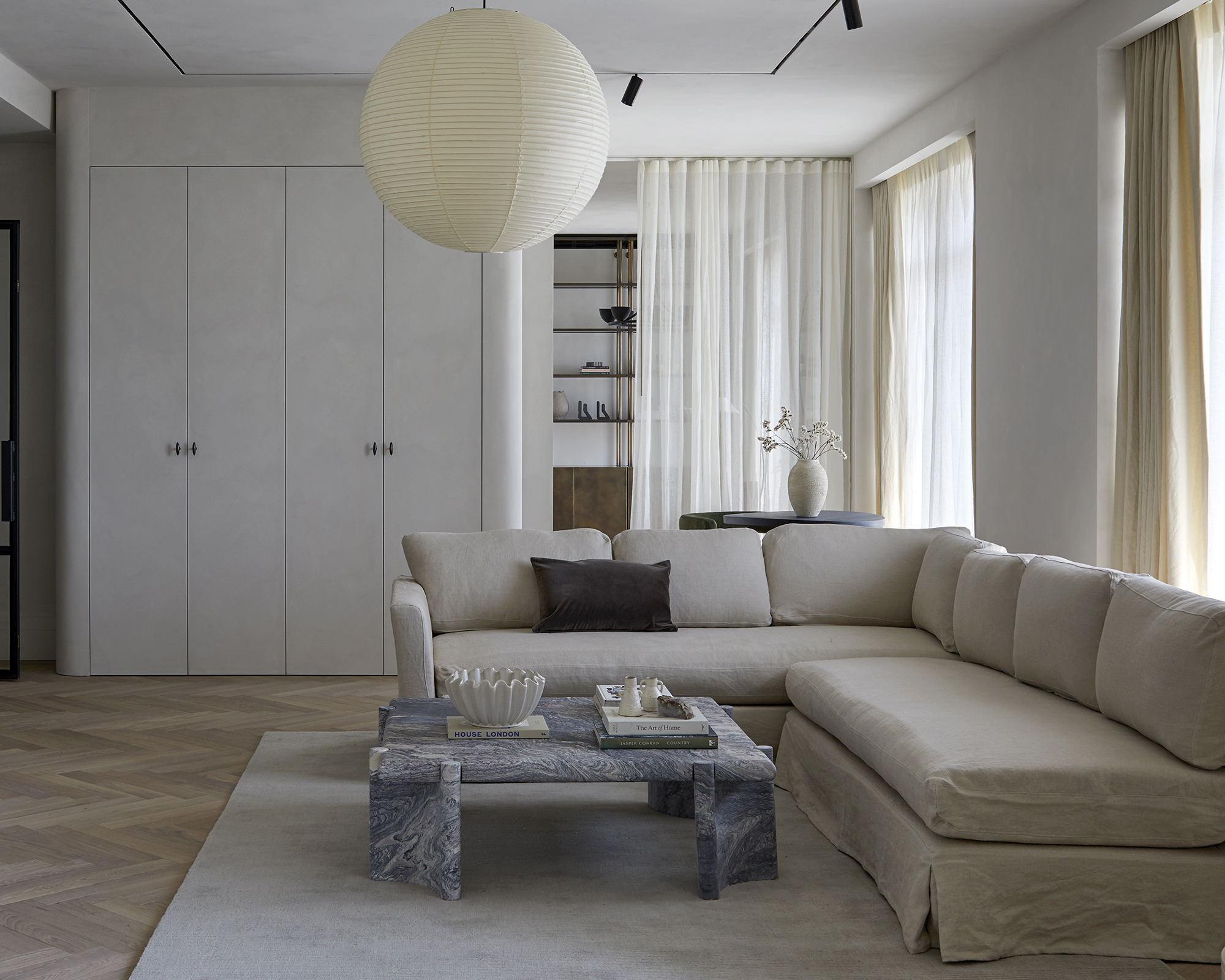 large grey corner sofa in a grey living room