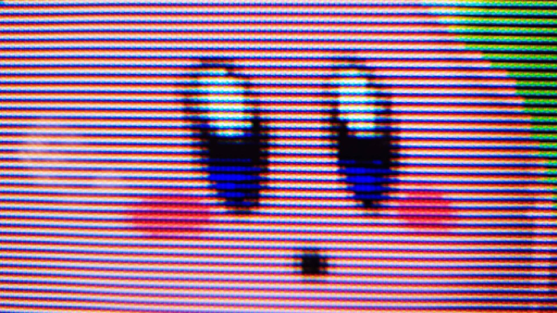 Close up of Analogue 3D Super Smash Bros gameplay featuring Kirby's face and visible CRT style scanlines/shadow mask effect.